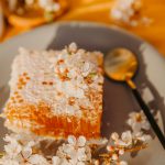 a-piece-of-cake-on-a-plate-with-a-spoon-rhru-jxgmh4